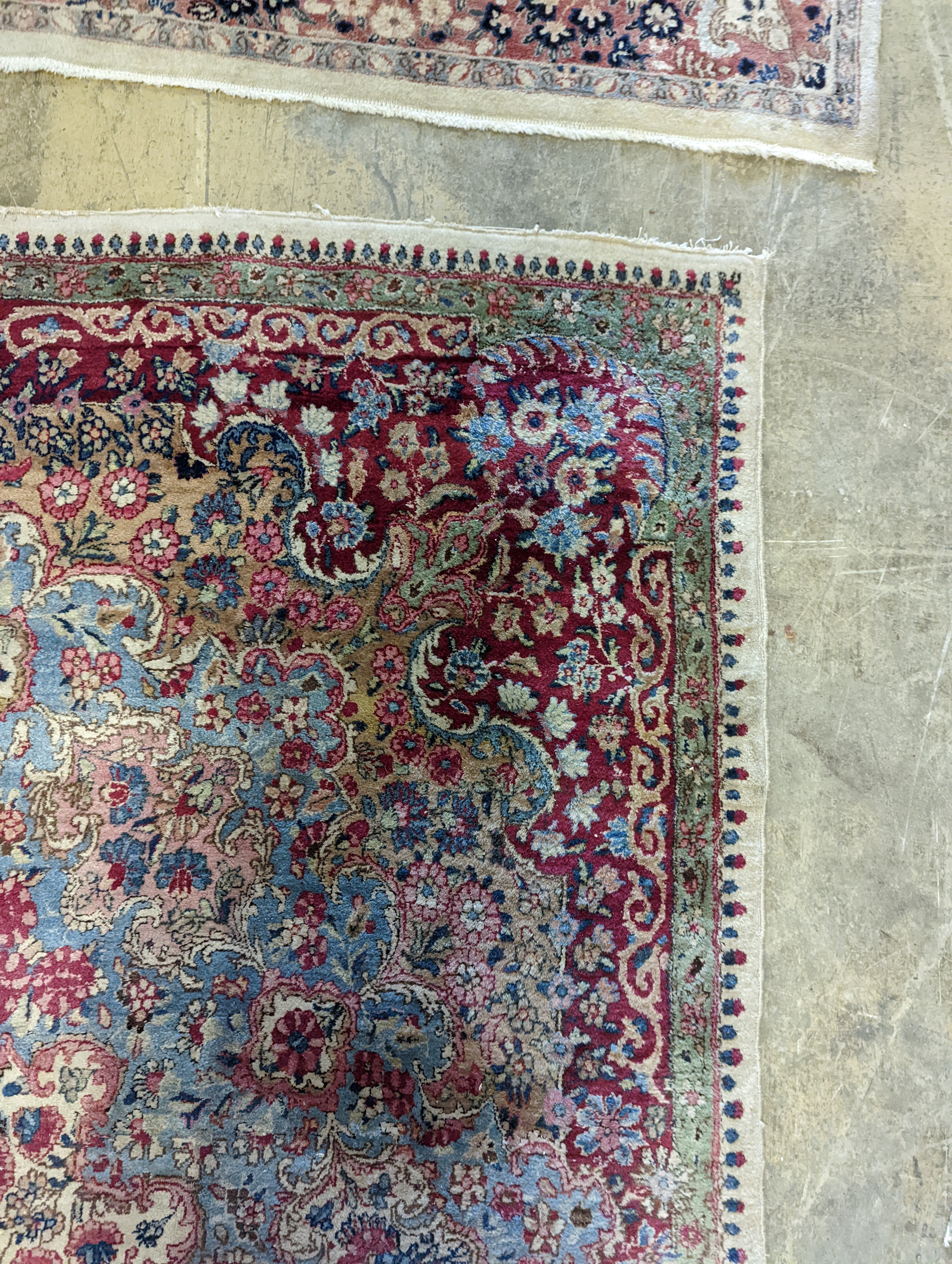 A North West Persian ivory ground carpet, 396 x 290cm